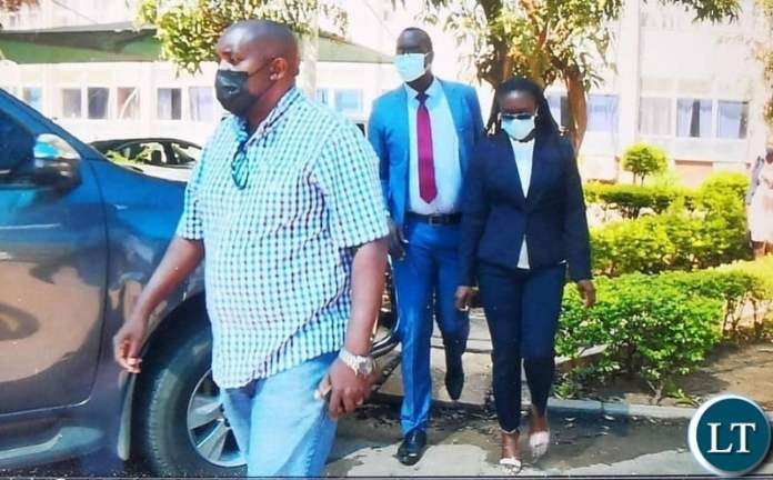 Faith Musonda in the company of her lawyers Makebi Zulu and Jonas Zimba at Zambia Police headquarters.