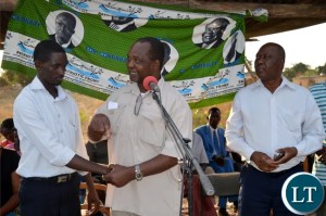 Patriotic Front Member of the Central Committee Syacheye Madyenkuku (middle) introduces Choma central Constituency party secretary Joel Kamoko to the residents (not in picture) of Sikalongo ward while constituency chairperson Timothy Siakaziba looks on