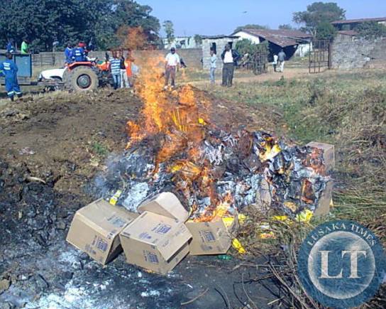 SOME corn flakes with traces of Genetically Modified Organism (GMOs) being destroyed by Luanshya Municipal Council workers at a dump site