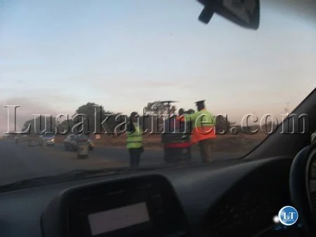 Police officer manning the police check point known in some circles as officers ATMs