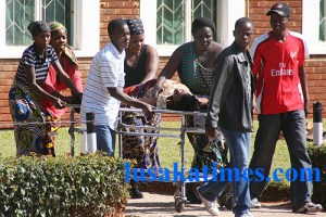 Family members take a sick relative to the casualty on a stretcher in the absence of health workers who are on strike at the University Teaching Hospital in Lusaka