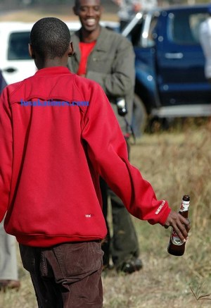 An unidentified youth on a 'drinking spree' 